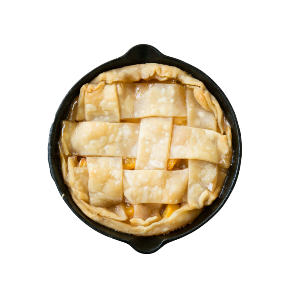 Unbaked pie with lattice crust in a black dish at home, isolated on black background.